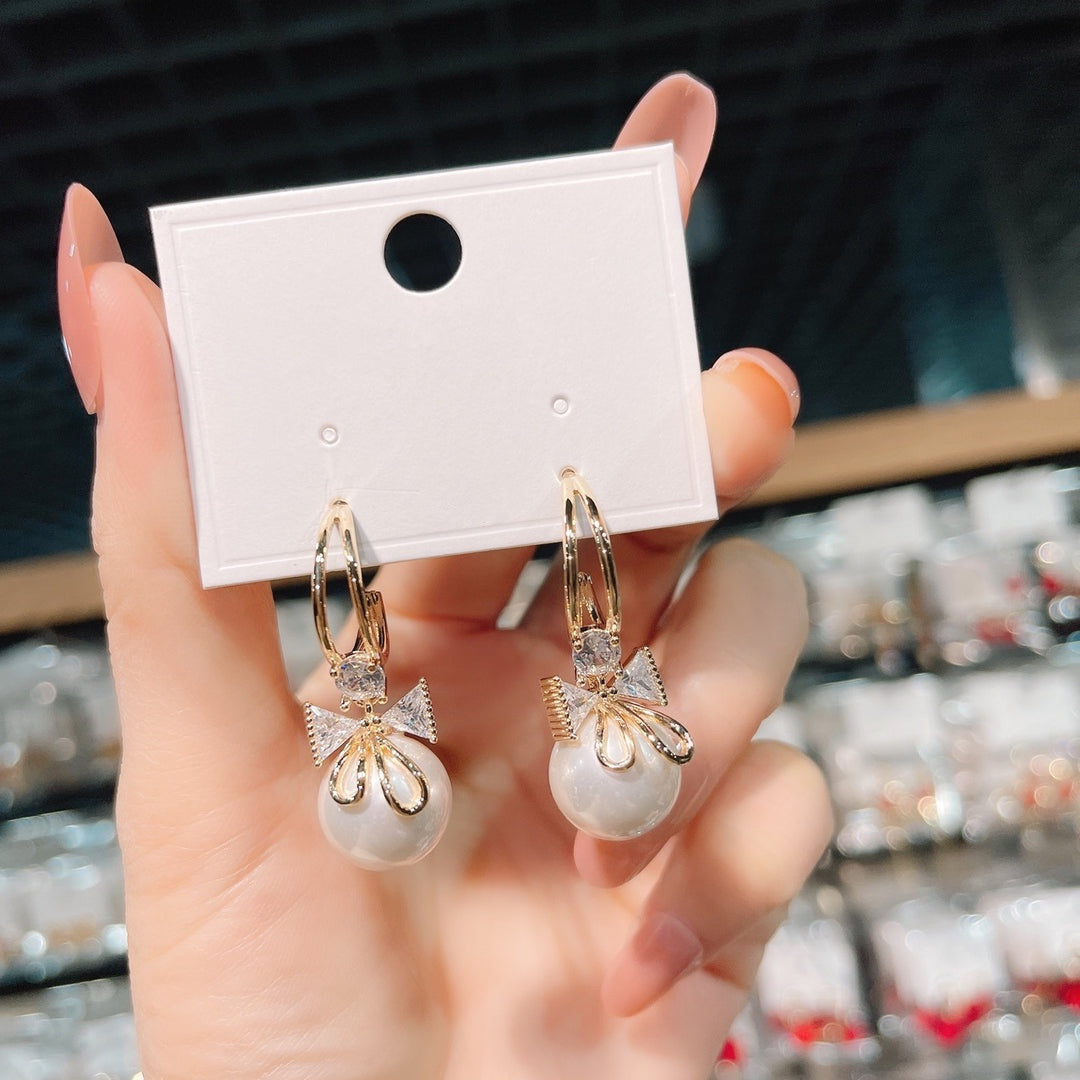 Pendientes de doble lazo con perlas