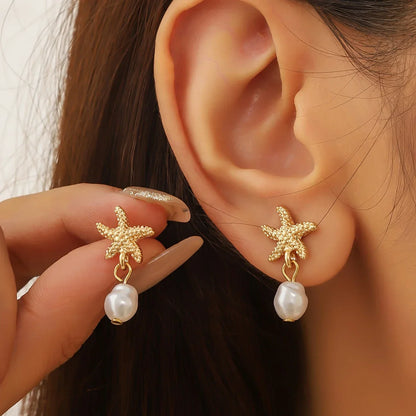 Pendientes Estrella de Mar con Borla de Perla Elegante