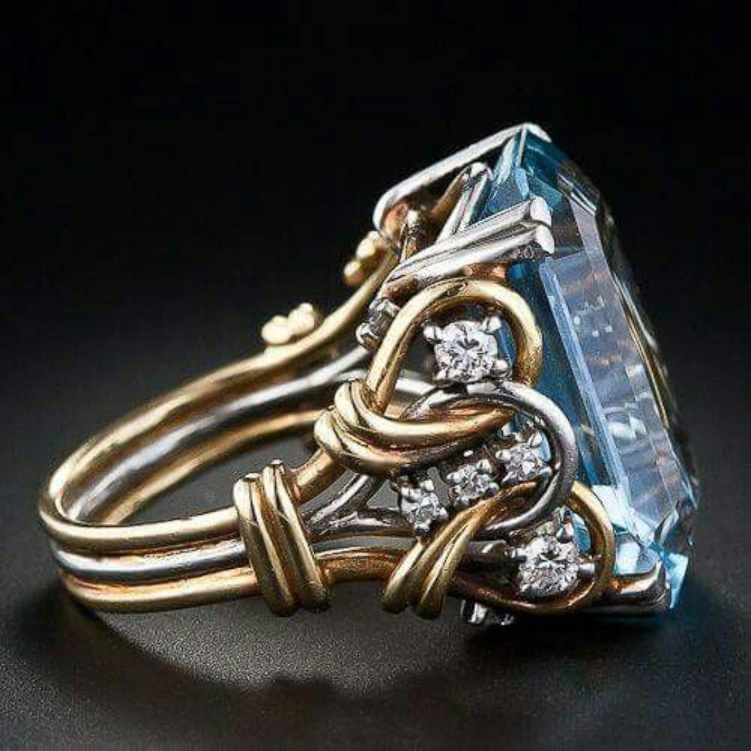 Anillo vintage de circonita azul y oro en capas