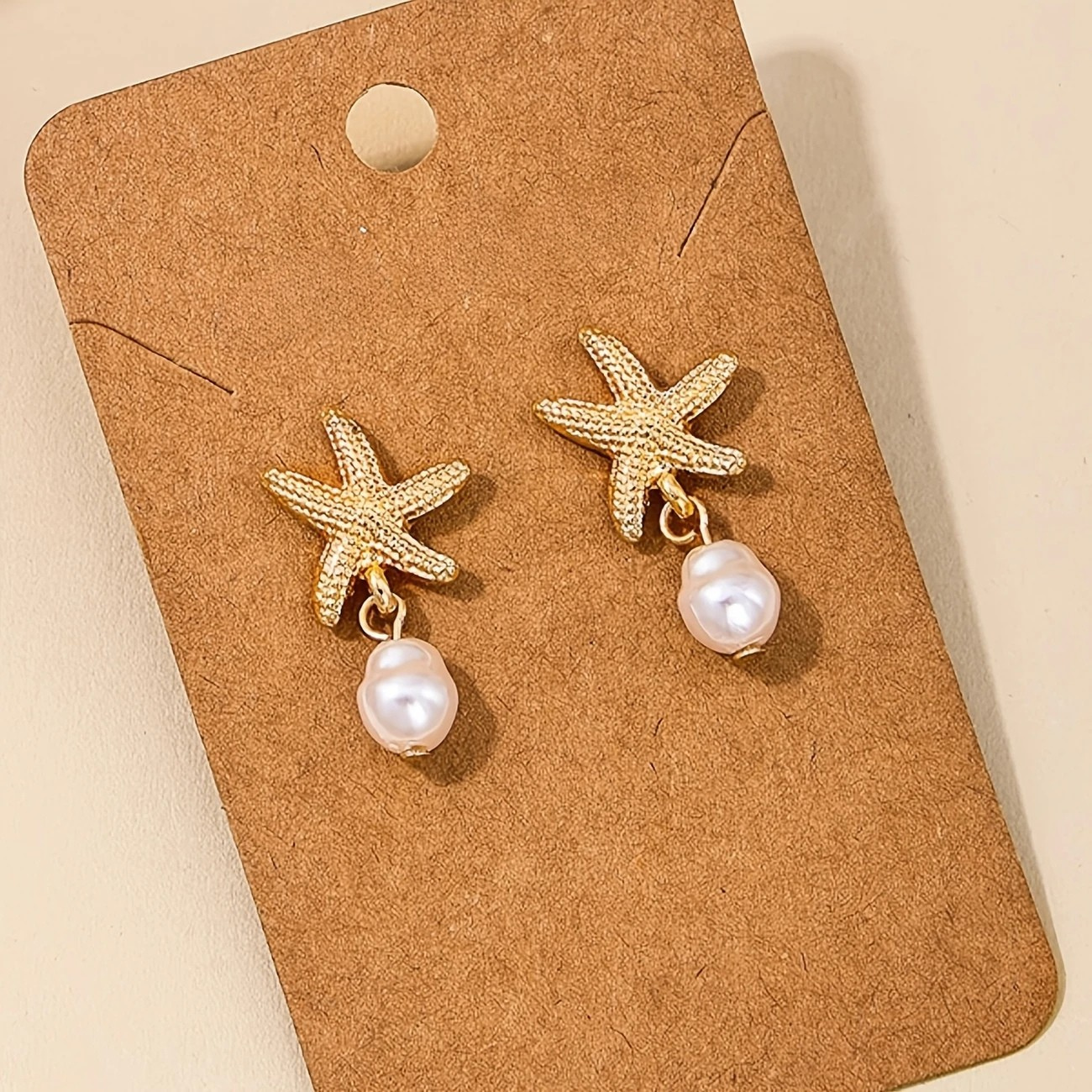 Pendientes Estrella de Mar con Borla de Perla Elegante