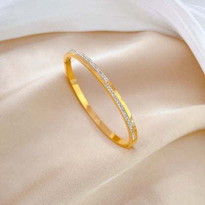 Pulsera rígida de cristal dorado Aera