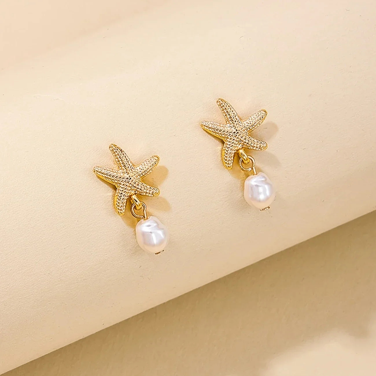 Pendientes Estrella de Mar con Borla de Perla Elegante